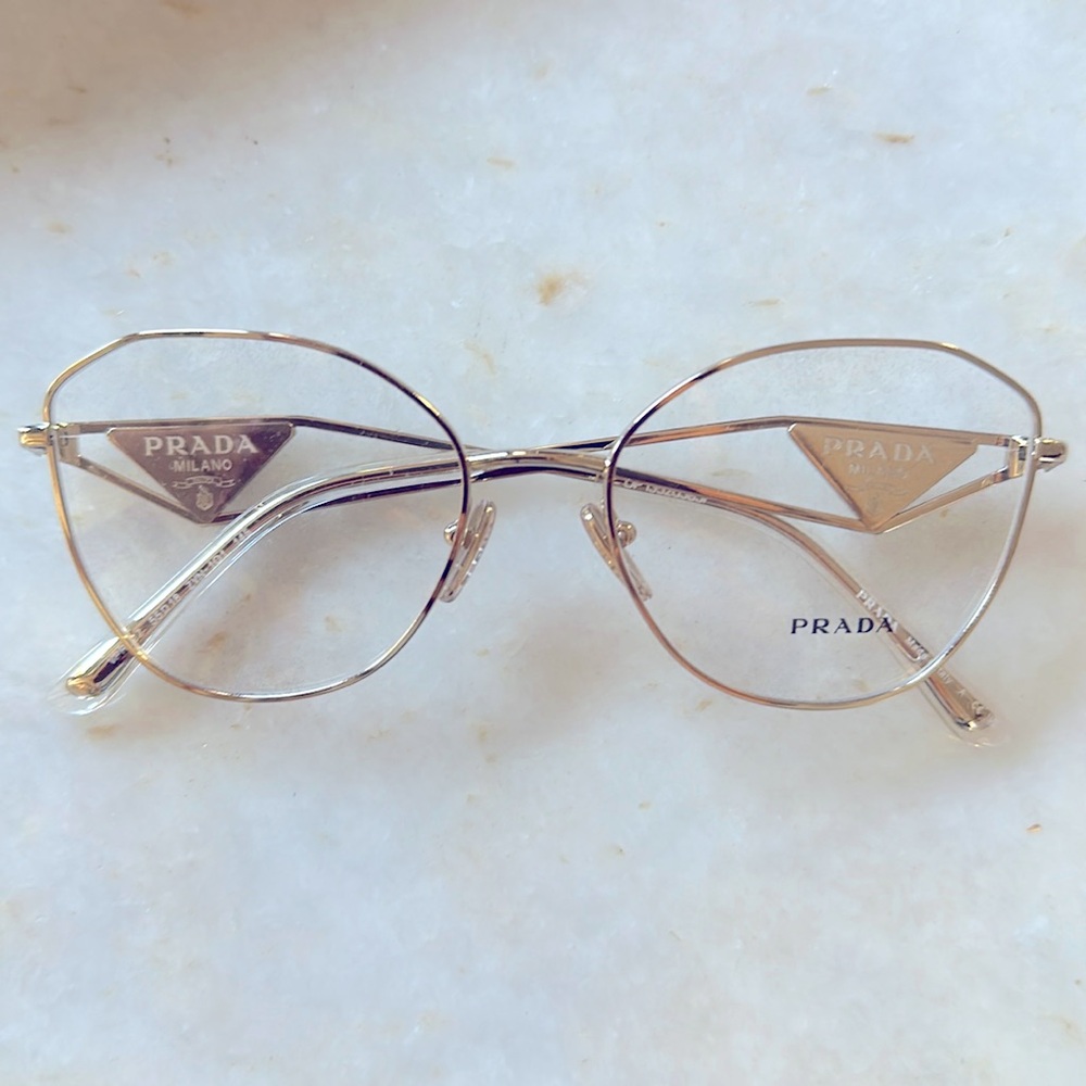 Brand new with tags! Has demo lens. “Pale Gold” color. PR52ZV